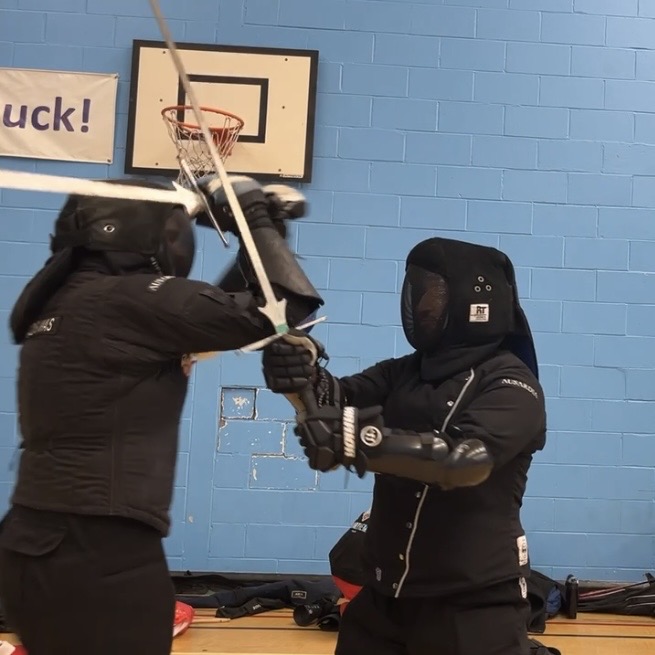 Olgun Tiltay learning Longsword sparring basics from Cosmas Cieplak-Mayr von Baldegg HEMA instructor in Ausardia